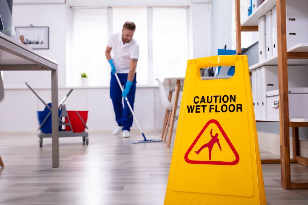 Wet floor hazard sign in workplace
